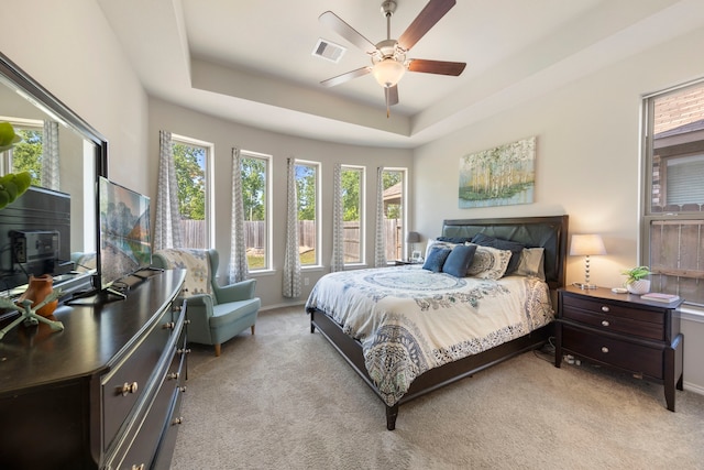32055 August Woods Way, Conroe, TX 77385 - bedroom featuring visible vents, light colored carpet, and multiple windows