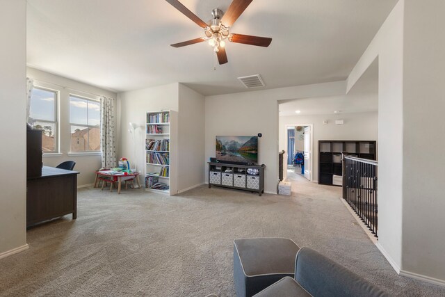 32055 August Woods Way, Conroe, TX 77385 - carpeted living room featuring baseboards, a ceiling fan, and visible vents