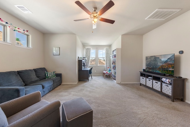 32055 August Woods Way, Conroe, TX 77385 - living area featuring carpet floors, visible vents, baseboards, and ceiling fan