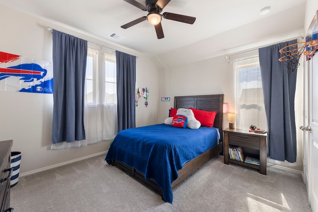 32055 August Woods Way, Conroe, TX 77385 - carpeted bedroom featuring ceiling fan, lofted ceiling, multiple windows, and visible vents