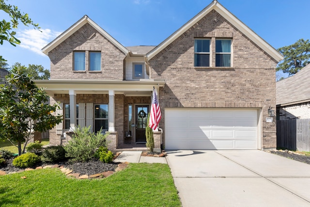 32055 August Woods Way, Conroe, TX 77385 - view of front of house with fence, concrete driveway, brick siding, and a garage