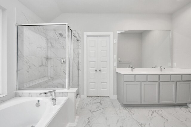 bathroom with a bath, marble finish floor, a sink, and a marble finish shower