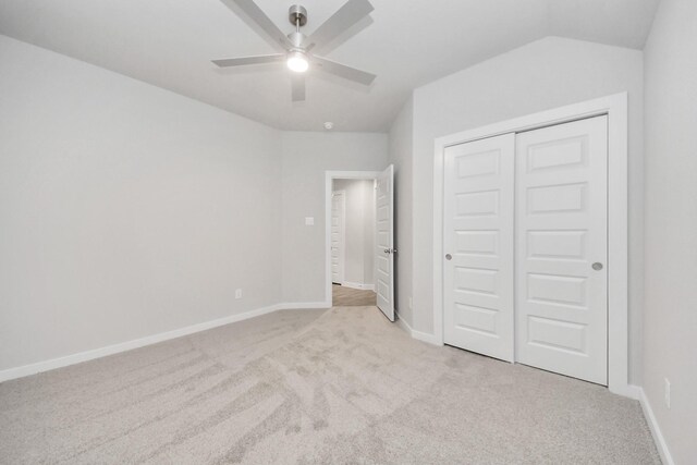 unfurnished bedroom featuring baseboards, carpet, a closet, and ceiling fan
