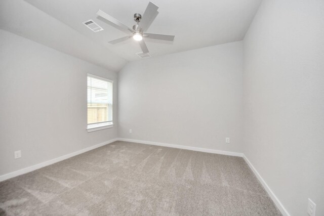 empty room featuring light carpet, baseboards, visible vents, and ceiling fan