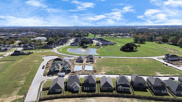 birds eye view of property with a residential view and a water view