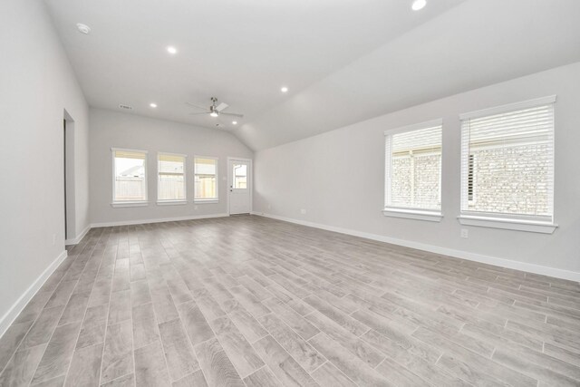 unfurnished living room featuring recessed lighting, vaulted ceiling, a ceiling fan, and baseboards