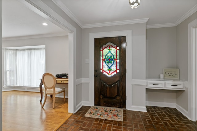 entrance foyer featuring baseboards, brick floor, and plenty of natural light