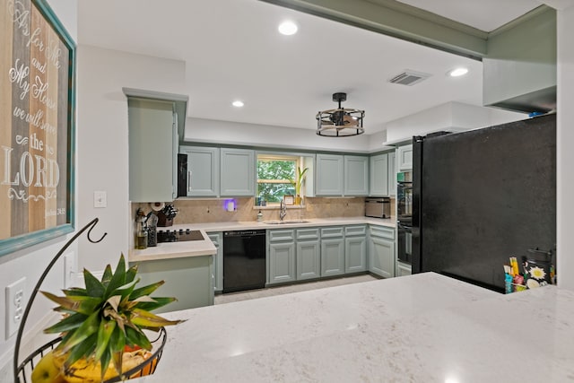 kitchen featuring black appliances, decorative backsplash, light countertops, visible vents, and recessed lighting