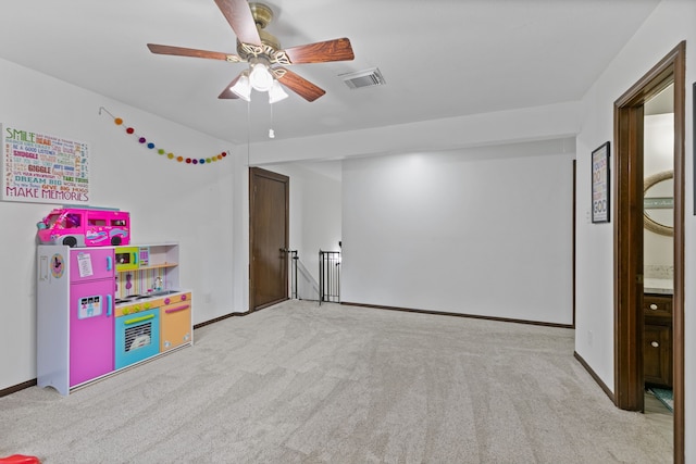 playroom featuring visible vents, carpet flooring, baseboards, and ceiling fan