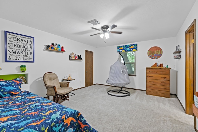 bedroom with visible vents, carpet flooring, baseboards, and a ceiling fan