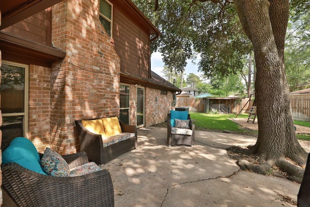 view of patio with an outdoor hangout area and a fenced backyard