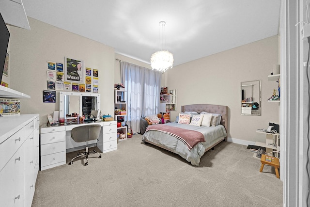 bedroom featuring an inviting chandelier and carpet