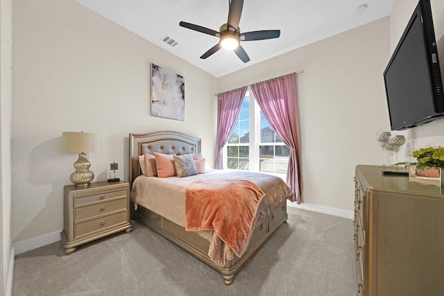 bedroom with light colored carpet, baseboards, visible vents, and a ceiling fan
