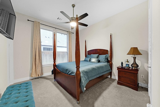 carpeted bedroom featuring visible vents, a ceiling fan, and baseboards
