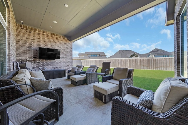 view of patio featuring an outdoor living space and a fenced backyard