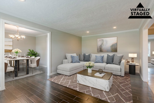 living room featuring an inviting chandelier, wood finished floors, baseboards, recessed lighting, and a textured ceiling