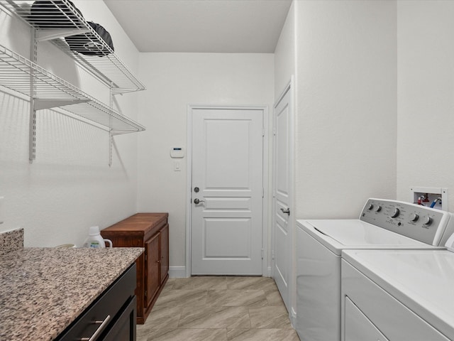 651 Tenuta Ln, League City, TX 77573 - washroom featuring washer and dryer, cabinet space, and baseboards