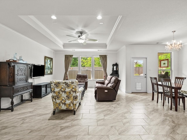 651 Tenuta Ln, League City, TX 77573 - living room with recessed lighting, a raised ceiling, ceiling fan with notable chandelier, and crown molding