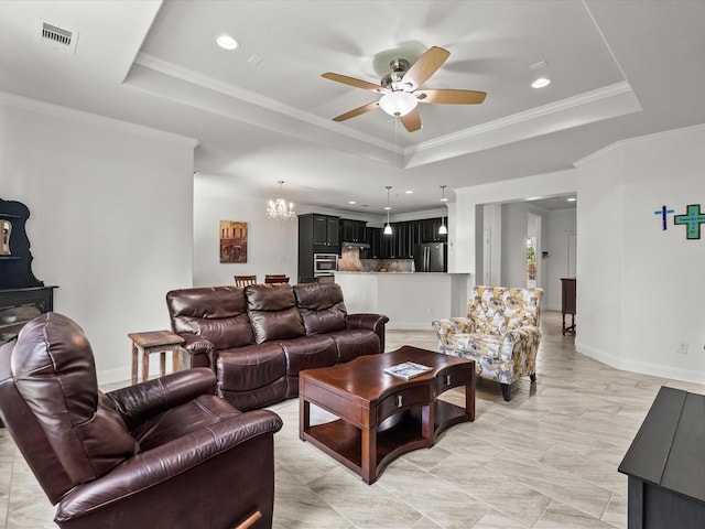 651 Tenuta Ln, League City, TX 77573 - living area featuring a raised ceiling, visible vents, baseboards, recessed lighting, and ceiling fan with notable chandelier