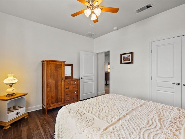 651 Tenuta Ln, League City, TX 77573 - bedroom featuring dark wood finished floors, baseboards, a ceiling fan, and visible vents
