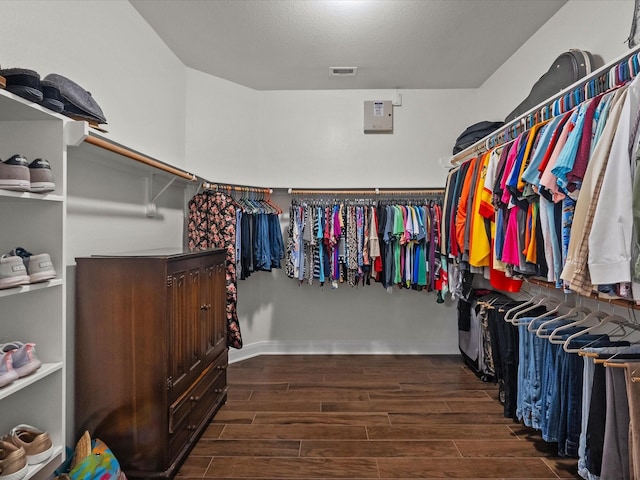 651 Tenuta Ln, League City, TX 77573 - spacious closet featuring wood finished floors and visible vents