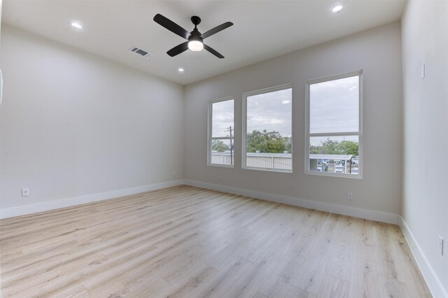 empty room featuring light wood finished floors, visible vents, recessed lighting, and ceiling fan