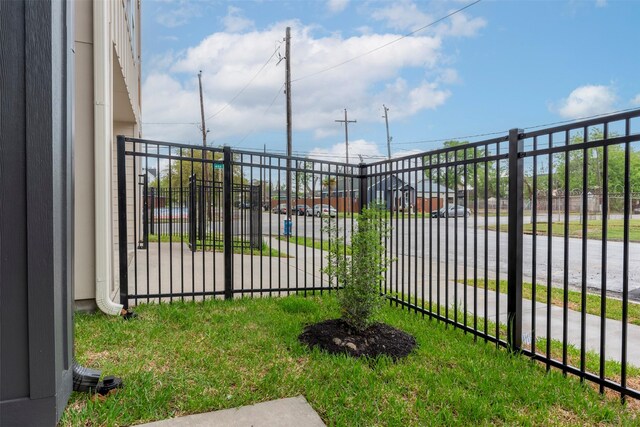 view of gate with fence