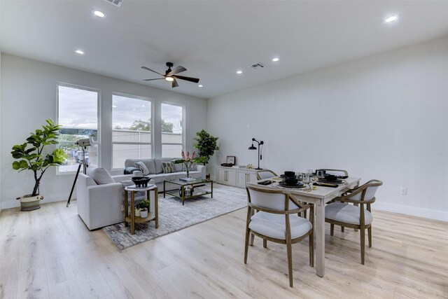 dining space with recessed lighting, visible vents, a ceiling fan, baseboards, and light wood-style flooring