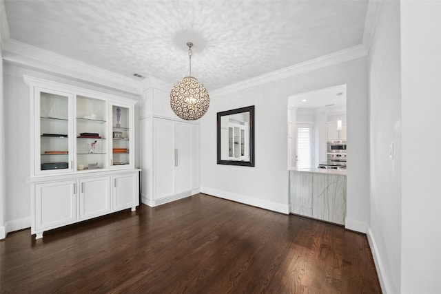 22 History Row, The Woodlands, TX 77380 - unfurnished dining area featuring dark wood-type flooring, visible vents, baseboards, and ornamental molding