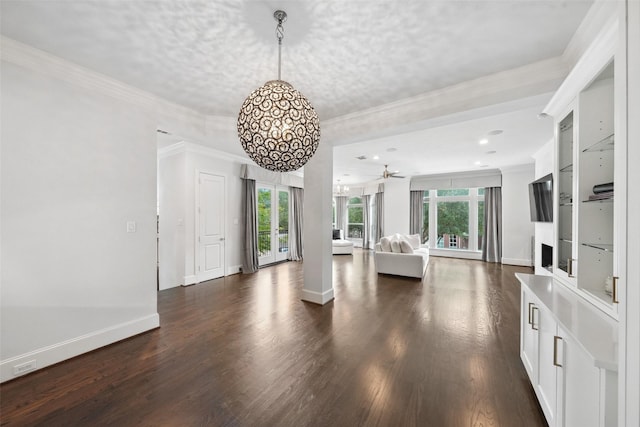 22 History Row, The Woodlands, TX 77380 - living room featuring ceiling fan, baseboards, and dark wood-type flooring