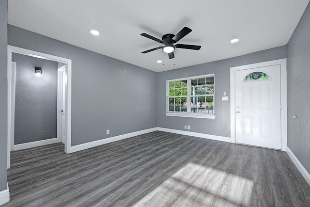 interior space featuring baseboards, a ceiling fan, dark wood finished floors, and recessed lighting