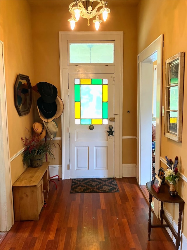 504 Gay Hill St, Brenham, TX 77833 - foyer entrance featuring a chandelier, wood finished floors, and baseboards