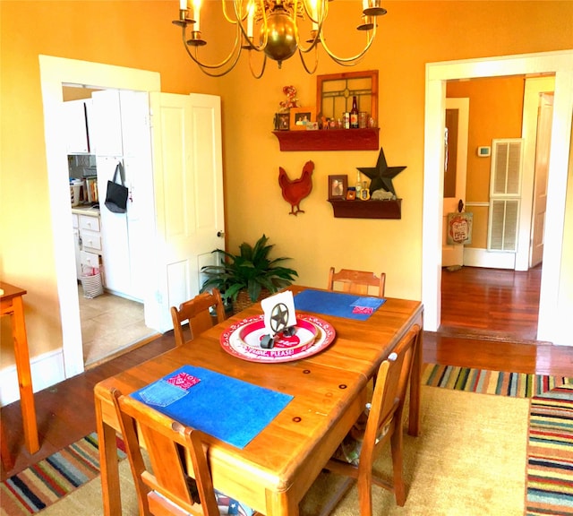 504 Gay Hill St, Brenham, TX 77833 - dining space with a notable chandelier and wood finished floors
