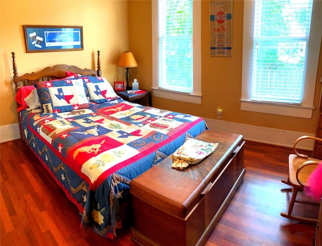 504 Gay Hill St, Brenham, TX 77833 - bedroom featuring baseboards and wood finished floors
