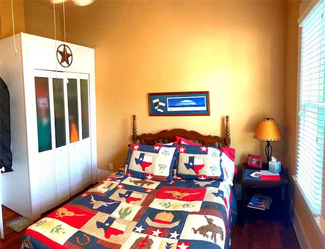 504 Gay Hill St, Brenham, TX 77833 - bedroom featuring baseboards, wood finished floors, and a closet