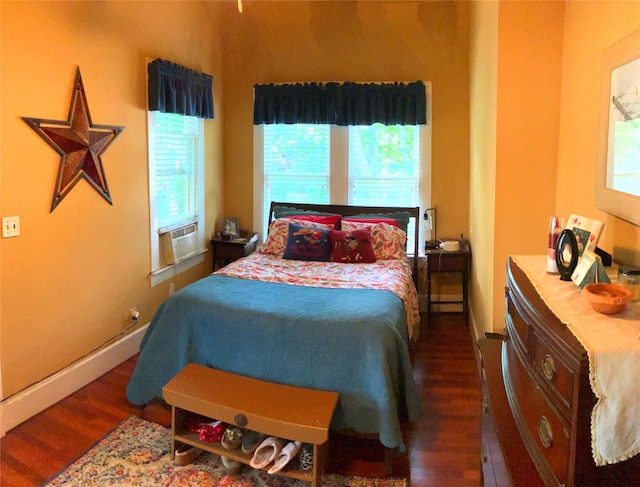 504 Gay Hill St, Brenham, TX 77833 - bedroom with wood finished floors, cooling unit, and multiple windows