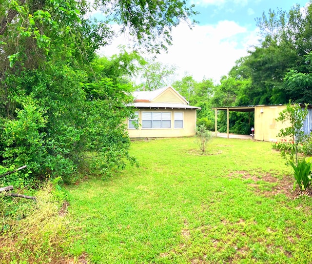 504 Gay Hill St, Brenham, TX 77833 - view of yard featuring an attached carport