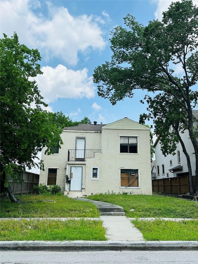 2038 Norfolk St Unit A, Houston, TX 77098 - view of front of home with fence, a balcony, and stucco siding