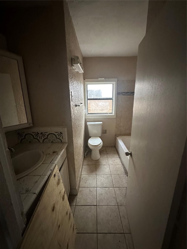 2038 Norfolk St Unit A, Houston, TX 77098 - bathroom featuring toilet, a bathtub, tile patterned flooring, and vanity