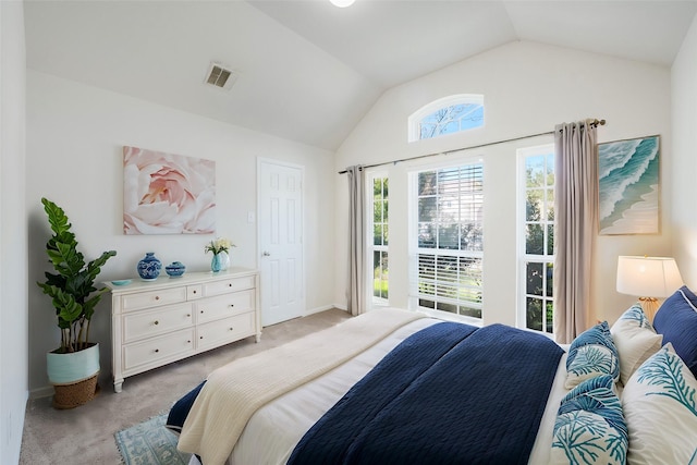 bedroom featuring lofted ceiling, light carpet, baseboards, and visible vents