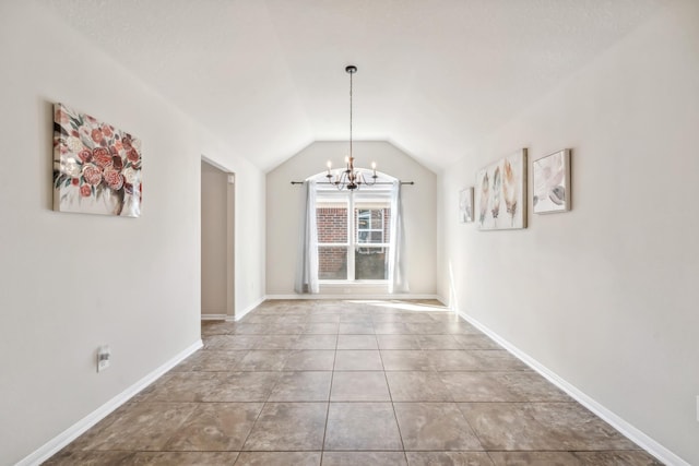 unfurnished dining area featuring vaulted ceiling, a notable chandelier, tile patterned floors, and baseboards