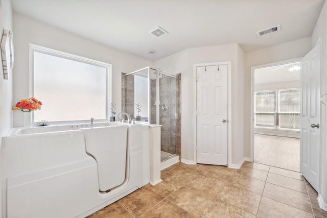 full bathroom with a bath, visible vents, and a shower stall