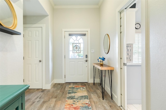29 Clara Barton Ln, Galveston, TX 77551 - entrance foyer with light wood-style floors, baseboards, and crown molding