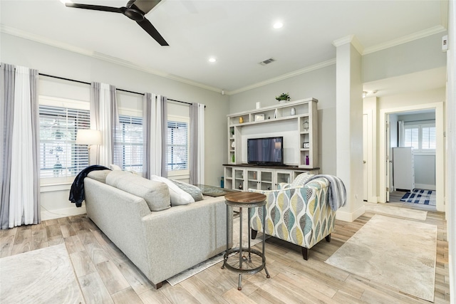 29 Clara Barton Ln, Galveston, TX 77551 - living area featuring ceiling fan, visible vents, light wood-style floors, ornamental molding, and recessed lighting