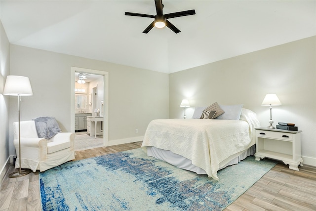 29 Clara Barton Ln, Galveston, TX 77551 - bedroom featuring lofted ceiling, baseboards, connected bathroom, a ceiling fan, and light wood finished floors