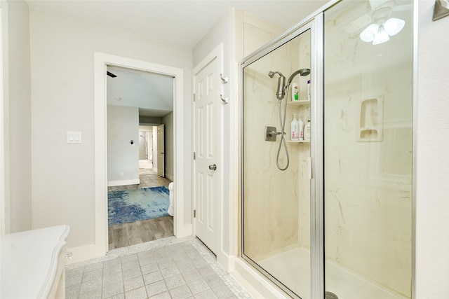 29 Clara Barton Ln, Galveston, TX 77551 - full bathroom featuring a marble finish shower, baseboards, and tile patterned flooring