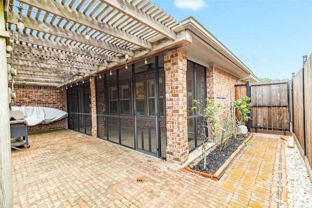 29 Clara Barton Ln, Galveston, TX 77551 - view of patio with a gate, fence, and a pergola