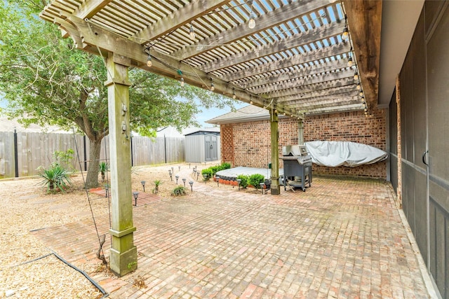29 Clara Barton Ln, Galveston, TX 77551 - view of patio / terrace with a pergola, a fenced backyard, area for grilling, a storage unit, and an outbuilding