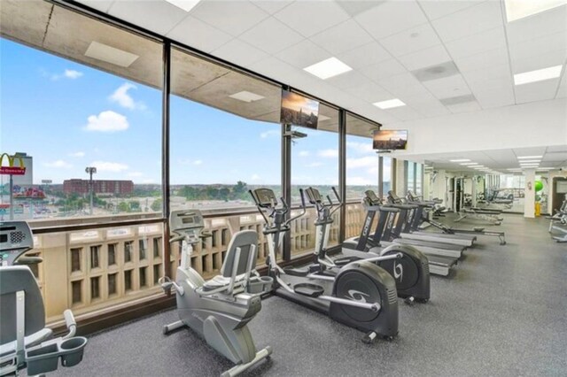 gym featuring a drop ceiling