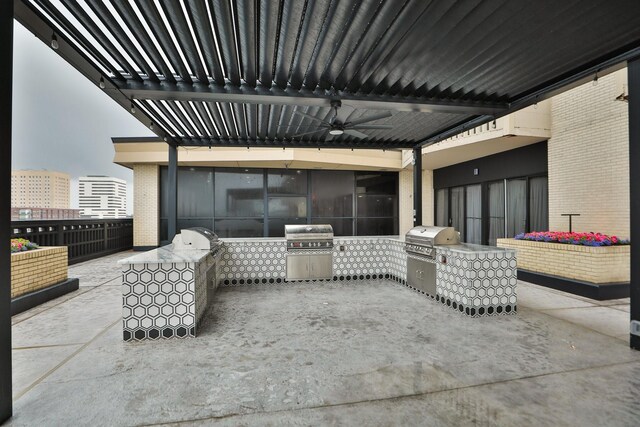 view of patio with a ceiling fan and area for grilling